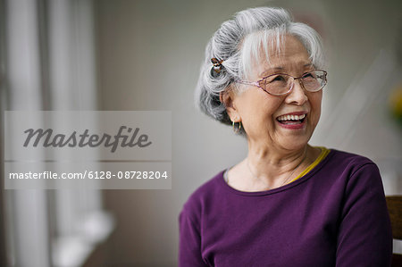 Portrait of a smiling senior woman at a doctor's office.