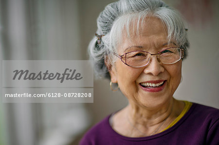 Portrait of a smiling senior woman at a doctor's office.