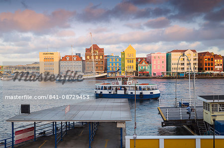 View of Otrobanda ferry terminal and Dutch colonial buildings on Handelskade along Punda's waterfront, UNESCO World Heritage Site, Willemstad, Curacao, West Indies, Lesser Antilles, former Netherlands Antilles, Caribbean, Central America View of Otrobanda ferry terminal and Dutch colonial buildings on Handelskade along Punda's waterfront, UNESCO World Heritage Site, Willemstad, Curacao, West Indies, Lesser Antilles, former Netherlands Antilles, Caribbean, Central America
