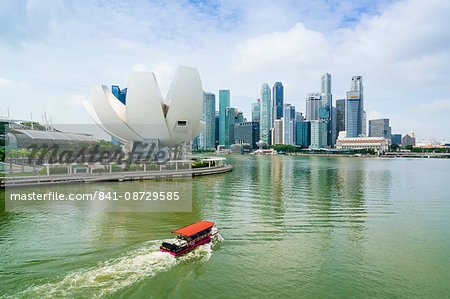 Singapore skyline, financial district skyscrapers with the lotus flower shaped ArtScience Museum in the foreground by Marina Bay, Singapore, Southeast Asia, Asia