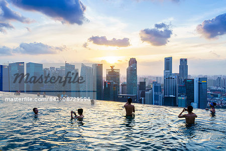 Infinity pool on the roof of the Marina Bay Sands Hotel with spectacular views over the Singapore skyline at sunset, Singapore, Southeast Asia, Asia