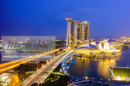 Busy roads leading to the Marina Bay Sands, Gardens by the Bay and ArtScience Museum at night, Singapore, Southeast Asia, Asia