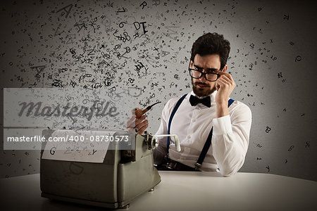 Man with glasses and pipe write with a typewriter