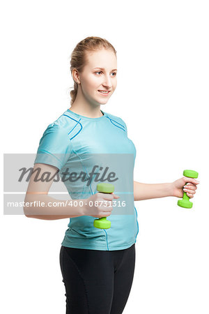 Athletic young woman works out with green dumbbells, isolated on white