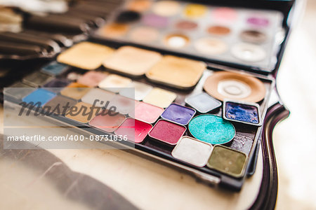 makeup cosmetics and brushes on the white table