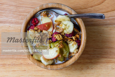 Bowl of milk with muesli, berries and fruits for breakfast. Superfood - very good and healthy