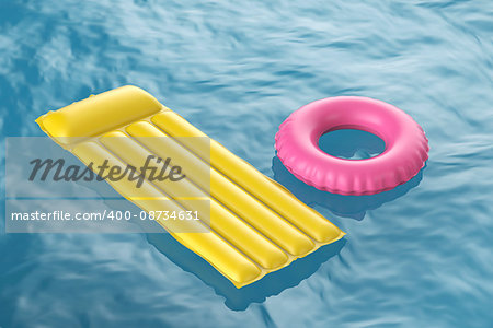Pool raft and swim ring floating on wavy water