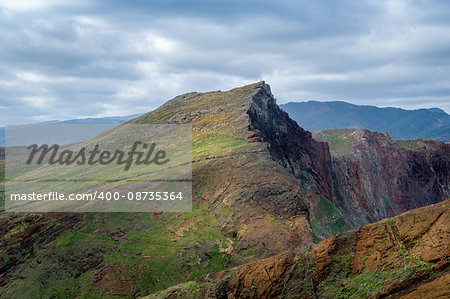 Mountain landscape of Madeira east coast. Famous hiking path through the fields and hills of volcanic tail of the island. Madeira, Portugal.