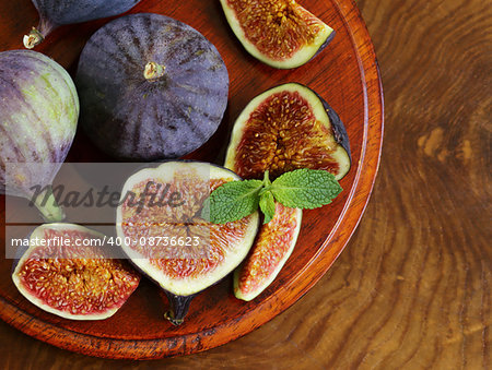 Natural ripe figs on a wooden board