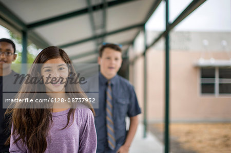 Friends walking together at high school.