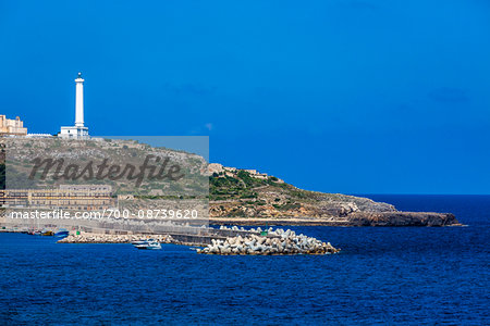 Coastal view with lighthouse at Santa Maria di Leuca in Castrignano del Capo in Puglia, Italy