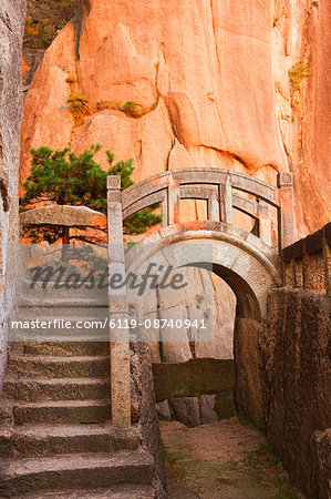 Steps, bridge, and last sunrays on rock face, White Cloud scenic area, Huang Shan (Yellow Mountain), UNESCO World Heritage Site, Anhui Province, China, Asia