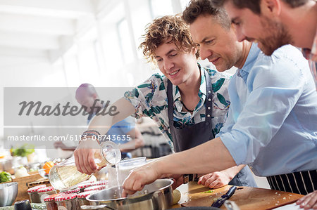 Male students in cooking class kitchen