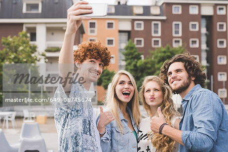 Friends taking selfie outdoors