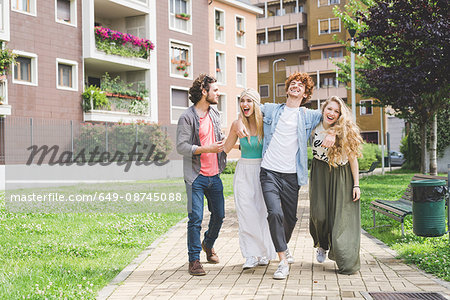 Friends walking in park