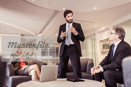 Mature businessman explaining at meeting