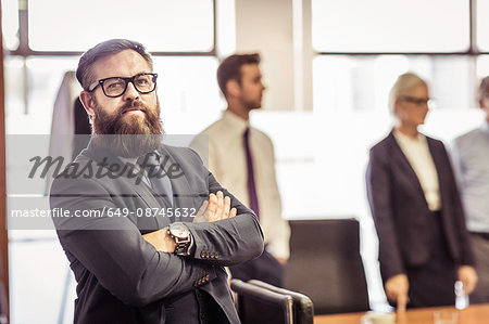 Portrait of bearded businessman in boardroom