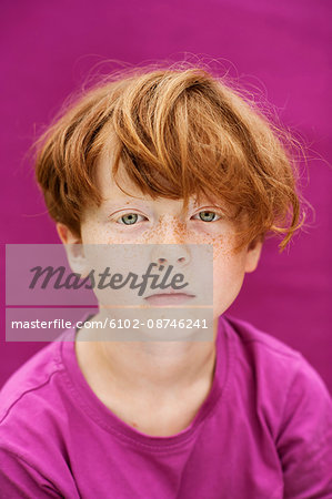 Studio shot of redhead boy