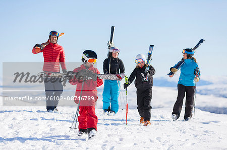 Father with children skiing