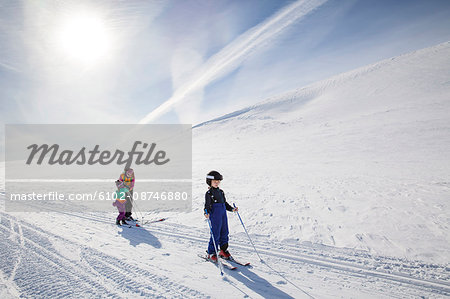Mother with children skiing