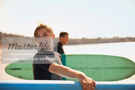 Portrait of young female surfer at the beach.