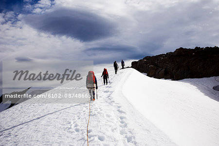 Group of people hiking in snow Group of people hiking in snow