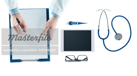 Doctor at desk writing a prescription on a clipboard on white background, top view