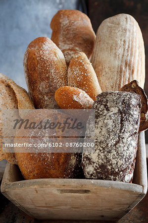 Various breads in wooden container