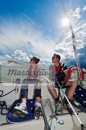 Man and woman sitting in sailing boat