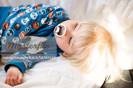 High angle view of boy sleeping