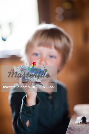 Boy playing Lego spaceship