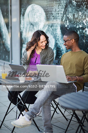 Young people working in cafe