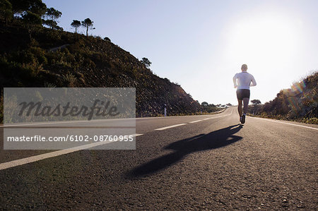 Runner running on road