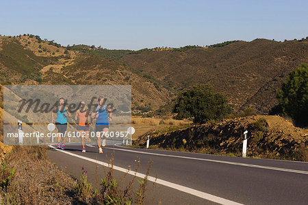 Runners running on road