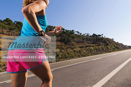 Woman jogging on road