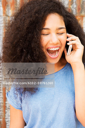 Teenage girl talking via cell phone