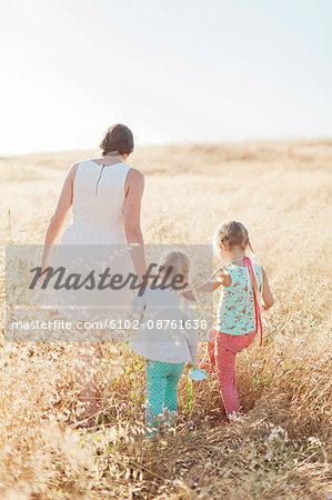 Mother with daughters in meadow