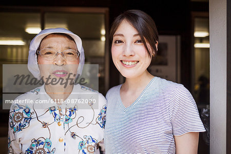 Two women at a noodle shop, a small unit with a fast food kitchen and unit producing Soba noodles