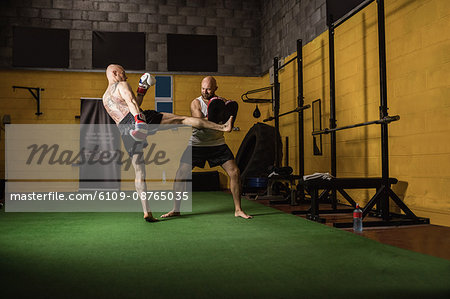 Thai boxers practicing boxing in the fitness studio