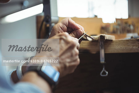 Close-up of craftswoman working in workshop