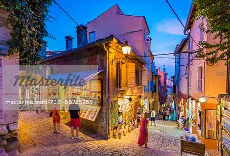 People at Shops in Alleyway at Dusk in Rovinj, Istria, Croatia