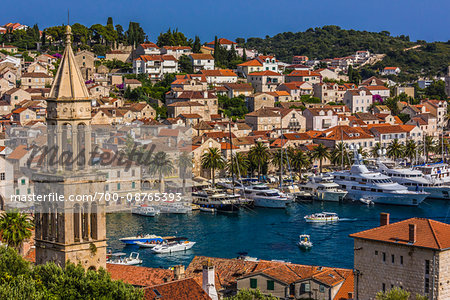 Yachts in the marina at the Old Town of Hvar with St Mark's Chruch bell tower (left) on Hvar Island, Croatia