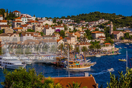 Marina with yachts and classic sailing ships in front of the Old Town of Hvar on Hvar Island, Croatia