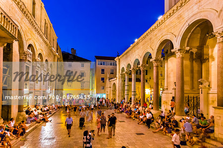 People sighseeing at the Peristyle in Diocletian's Palace at dusk in the Old Town of Split in Split-Dalmatia County, Croatia