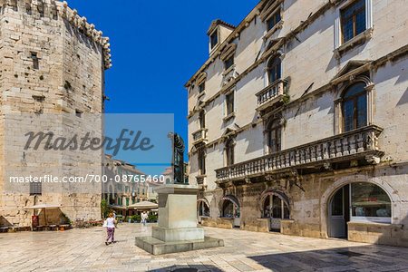 Fruit Square and the Monument to Marko Marulic with the Milesi Palace on the right in the Old Town of Split in Split-Dalmatia County, Croatia