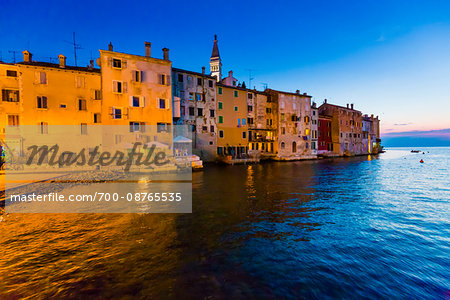 Waterfront and buildings at sunset at the fishing port city of Rovinj in the north Adriatic Sea in Istria, Croatia