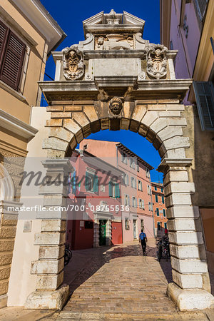 Looking through the 17th century Balbi's Arch old Town Gate in the city of Rovinj in Istria, Croatia