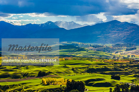 Rain clouds over the mountains and the Wakatipu Basin near Queenstown in the Otago Region of New Zealand