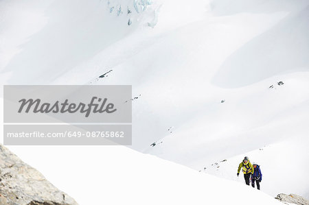 Mountaineers ski touring on snow-covered mountain, Saas Fee, Switzerland