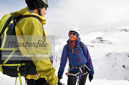 Mountaineers on snow-covered mountain smiling, Saas Fee, Switzerland
